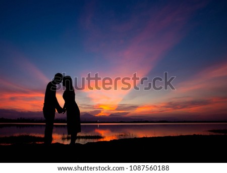 Couple shadow in love with beautiful light after sunset.