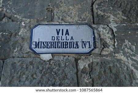Italy: Road sign (Mercy street).