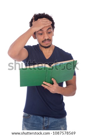 Student holding a book and he remembered something he didn't write it on the exam so he hitting his forehead with his hand, isolated on white background