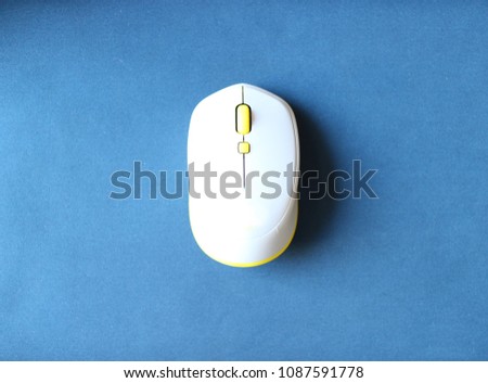 white computer mouse on a blue background