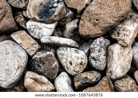 Pebbles, Several stones on the floor.