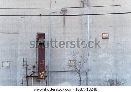external wall of grain storage silo and chute 