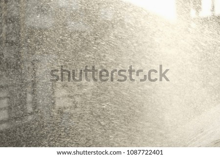 abstract of spraying of water in evening light