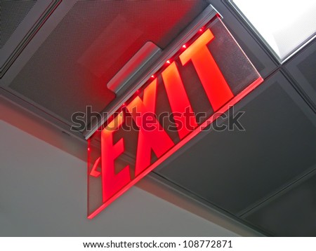 exit emergency sign inside of silver surface, rescue red led light, evacuation, modern fire security diversity
