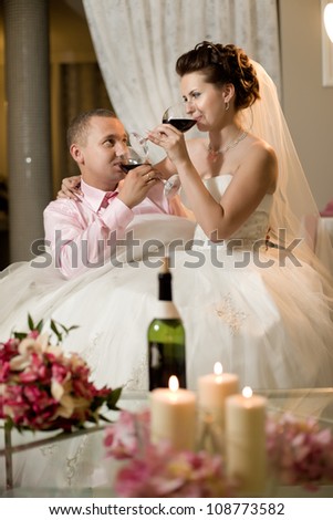 newly married couple sit at table in restaurant,  romance wedding dinner