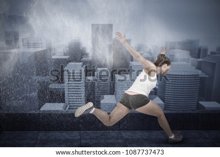 Composite image of athletic woman running 
