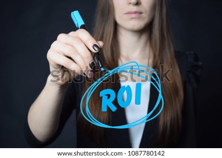 The businessman writes a blue marker inscription:ROI