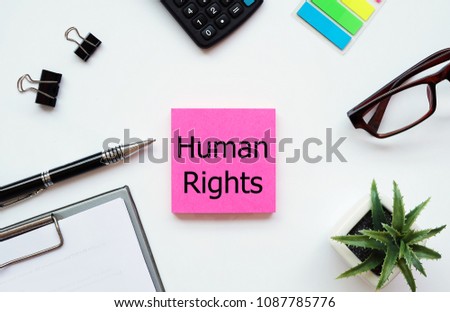 Top view white background desktop with pink Note write text Human rights for business human resource and finance concept.