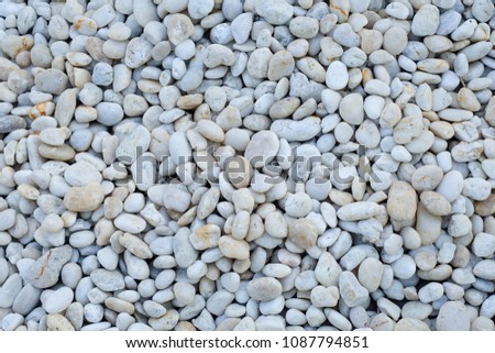 White and gray stone texture and abstract background.Pebble stones texture.