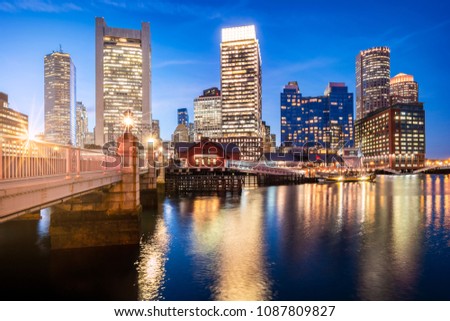 Panoramic view of the Boston Harbor and Financial District at Night.