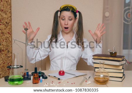 Emotional student girl on chemistry lesson. Pharmacist or apothecary woman. Scientific experiment background. Funny young intern in chemical laboratory concept.
