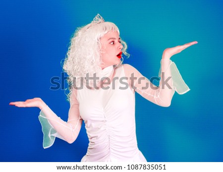 A picture of a pretty woman in a long curly veil and a diadem presenting your imaginary product over a colorful background