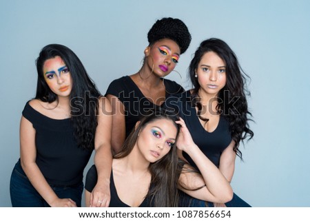 A group of fashion models posing at a photo shoot