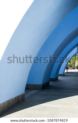Arched architectural elements in blue, background