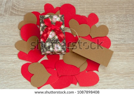 Holiday background with hearts and gifts