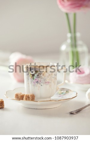 Early morningbreakfast. Vintage cup of coffee and sweets on the table 