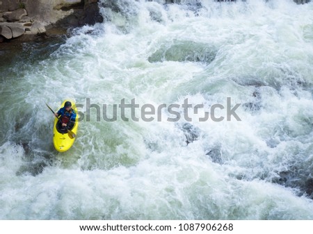 Kayaking, rafting along the mountain river