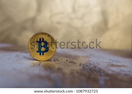  golden bitcoin stand on blurred background