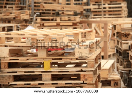 stacks of wooden pallets in a yard no people stock photo
