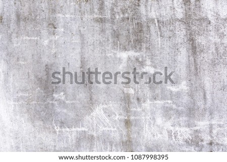 Abstract light gray background with scratches and stains. Texture of old plaster, putty. Bright beautiful picture.