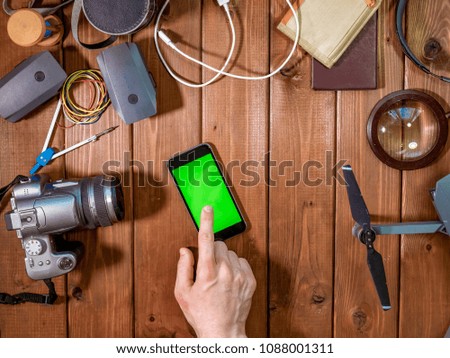 phone chroma key on the table with travel concept