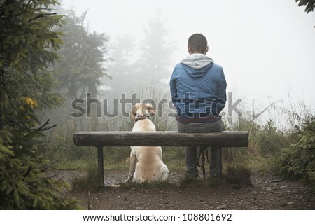 Lost man with his dog in mountain. Royalty-Free Stock Photo #108801692