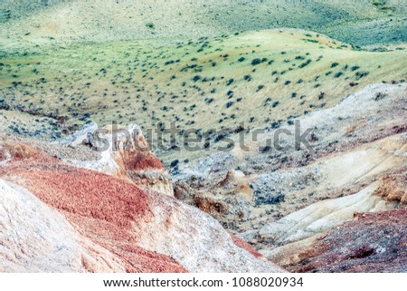 Colorful red hills and canyons in pastel colors. Autumn mood of nature, travel through the mountains of Altai.