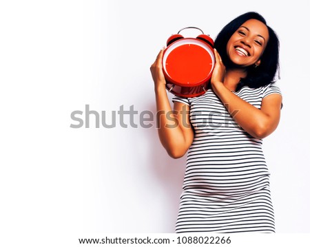 young pretty african american woman pregnant happy smiling, posi