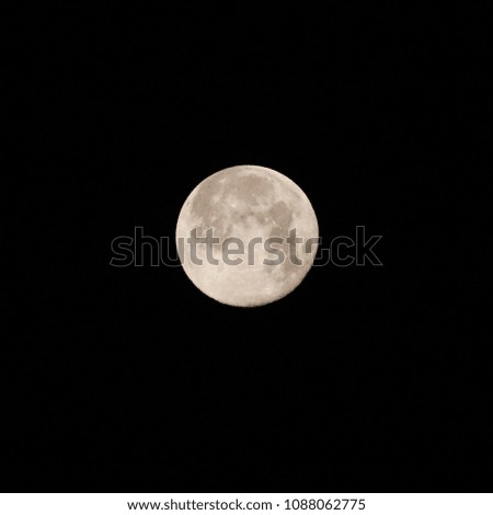 Full moon isolated on black dark night background.