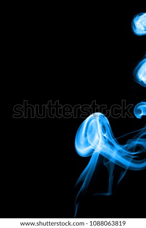 Smoke magical color isolate from black color background (vertical).