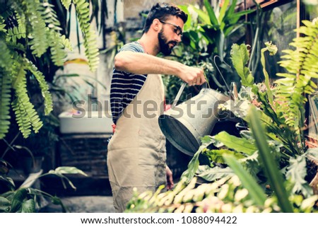 White man taking care of the plants