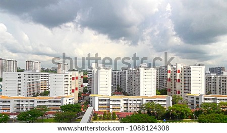 Aerial View of Singapore's HDB under cloudy blue sky