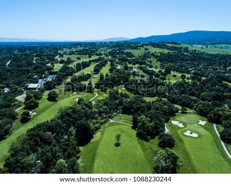 Aerial photograph of blue sky and golf course.