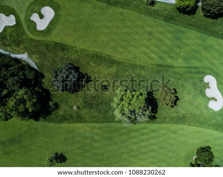 Aerial photograph of forest and golf course.