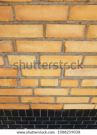 Brick wall above the tile