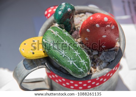Stone cactus in iron mug for room decor Royalty-Free Stock Photo #1088261135