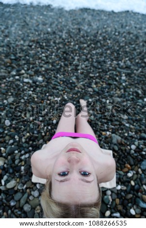 Young blonde girl on the beach