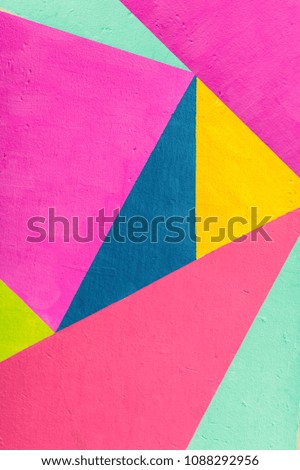 Geometric background of wall with bright tones. 