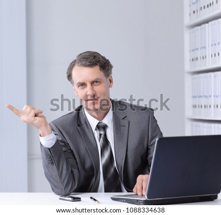 closeup . confident businessman pointing at copy space.