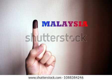 One finger with ink stained. Suitable for anything  about latest Malaysia politic status.