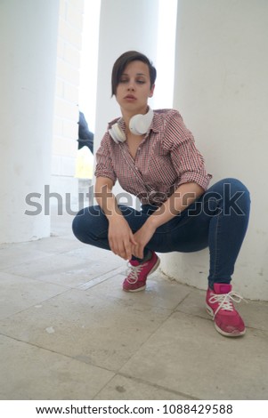 woman with headphones listening music .