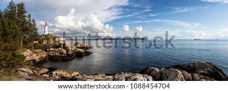 Beautiful panoramic view of a Lighthouse on a rocky coast during a cloudy evening. Taken in Horseshoe Bay, West Vancouver, British Columbia, Canada. Royalty-Free Stock Photo #1088454704