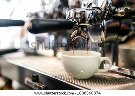 coffee extraction from professional coffee machine  Royalty-Free Stock Photo #1088560874