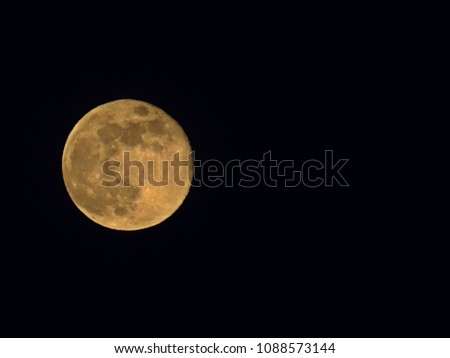 Beautiful Full Moon observed during Night on a Black Sky