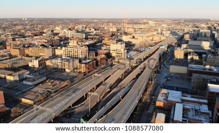  Aerial view of american city at dawn. High-rise  buildings, freeway, bay.  Sunny morning. Milwaukee, Wisconsin, USA
