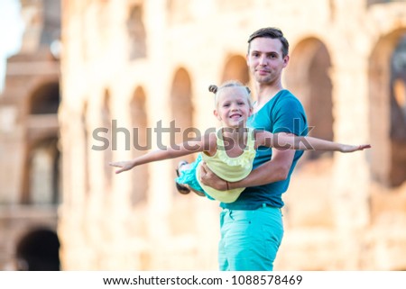 Young father and little girl background Colosseum, Rome, Italy. Family portrait at famous places in Europe