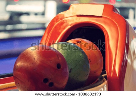 Colorful bowling balls on the bowling track. Game and Fun