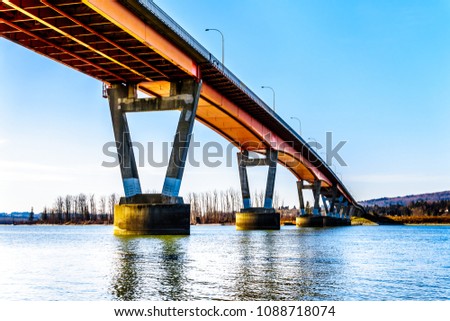 Mission Bridge over the Fraser River on Highway 11 between the towns of Abbotsford and Mission in British Columbia, Canada Royalty-Free Stock Photo #1088718074