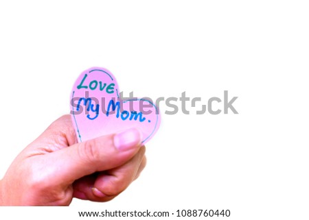 Everyday is mother's day. Not a single day I stop loving you. You are the one and only one in my life.
A woman holds a heart paper written that love my mother. white background.