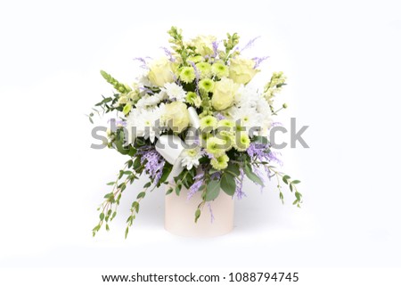 Bouquet of flowers in the box isolated on white background. Space for your text.